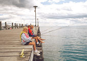 Girls Fishing off Dock