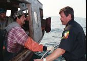 Bay Mills Conservation Officer Inspecting Tribal Fishing Vessel